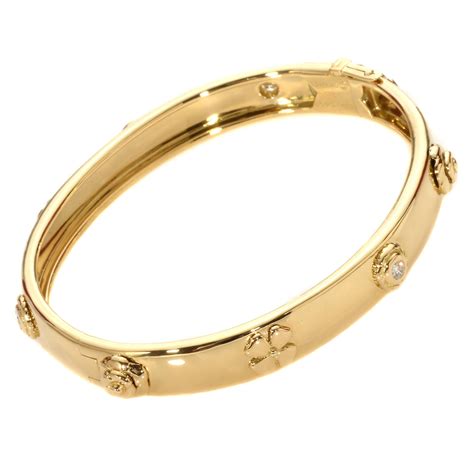 chanel camellia gold bangle bracelet.